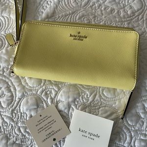 Kate Spade fashionable & functional limoncello wristlet